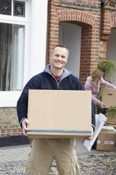 Professional removal company team handling a home move with care