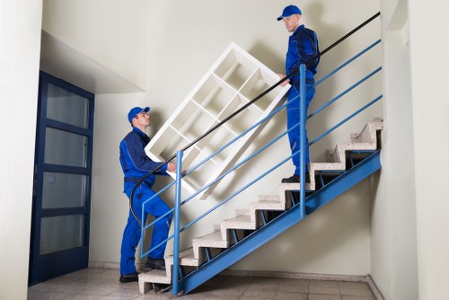 Professional movers handling a flat removal in the Removals area