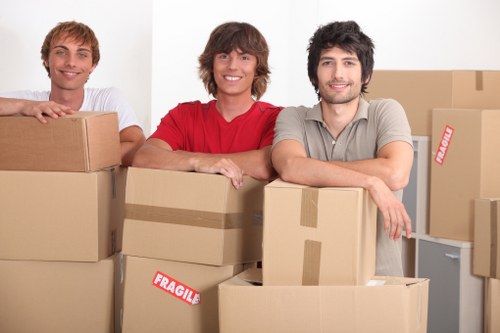 Local removals team handling packed household goods and furniture