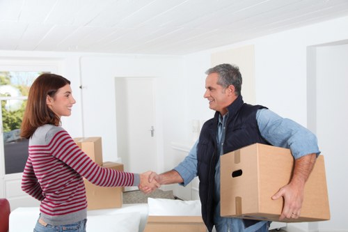 Loading furniture and boxes into a removals van for a local move