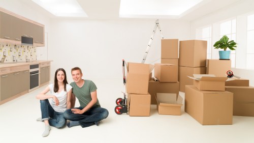 Packed boxes and furniture prepared for loading into a van