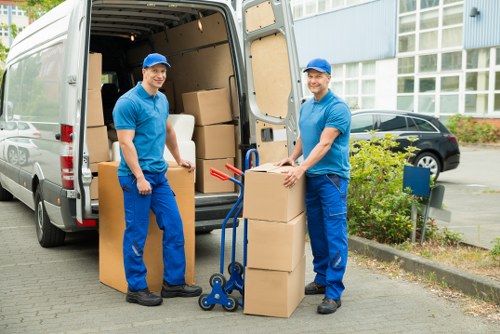 Local moving team handling boxes and household items