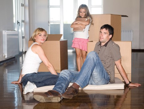 Careful wrapping of fragile household items for a move in Removals